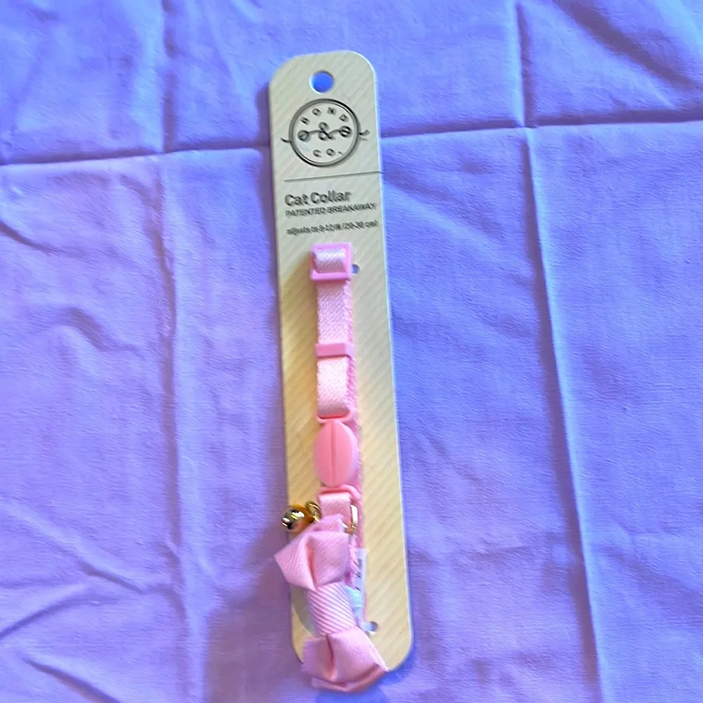 Brand new pink cat collar with pink bow tie.